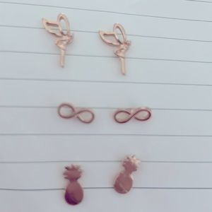 Fairy, infinity sign, and pineapple earrings.